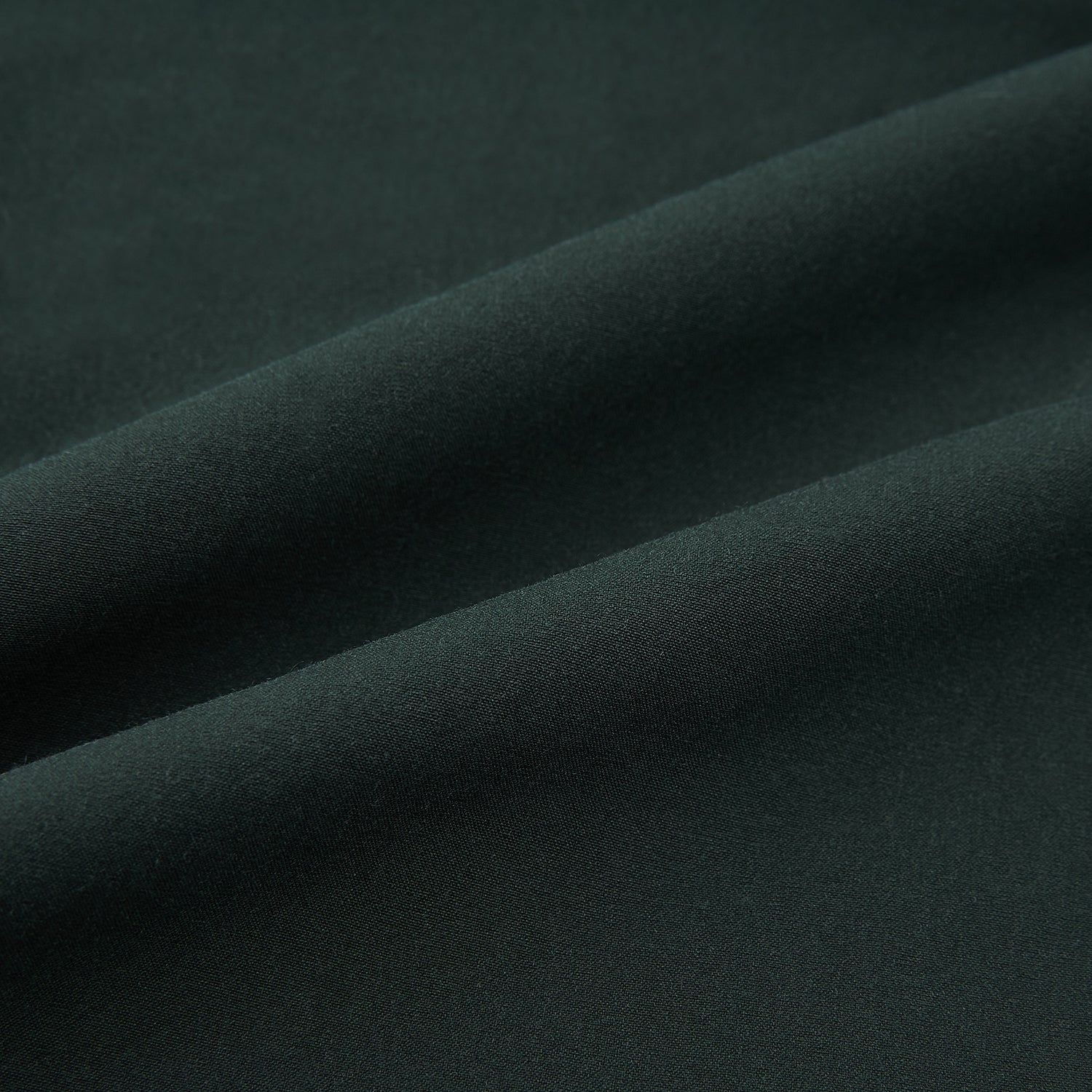 View 7 of product The Hunter Green Winston Trousers by Turnbull & Asser are crafted in high-twist cotton with straight legs, belt loops, button closure, and front zipper, shown against a plain light background.