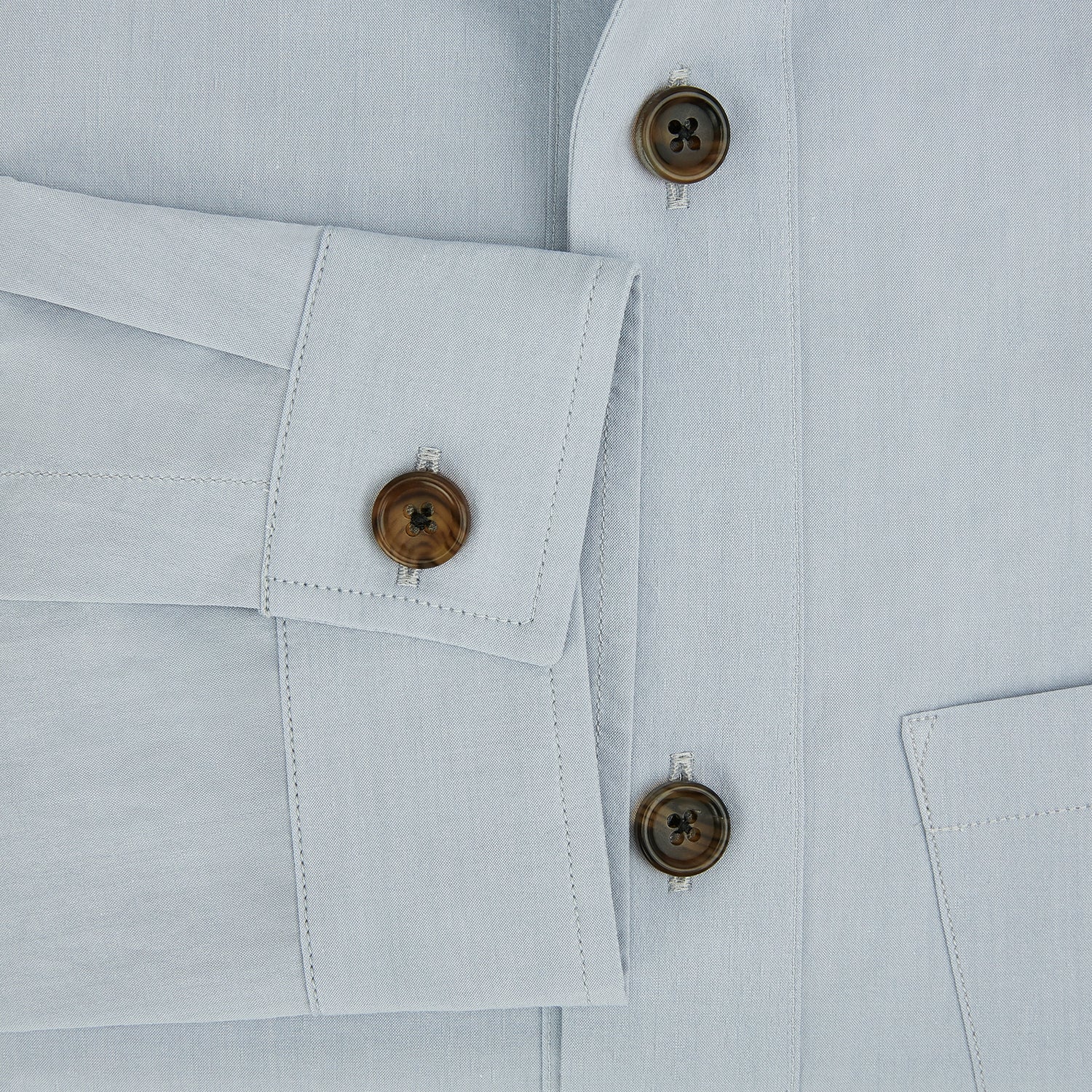 View 4 of product The Turnbull & Asser Grey Hyde Overshirt is a long-sleeve button-up made from sanforised cotton, featuring a single chest pocket and dark buttons, shown against a plain white background.