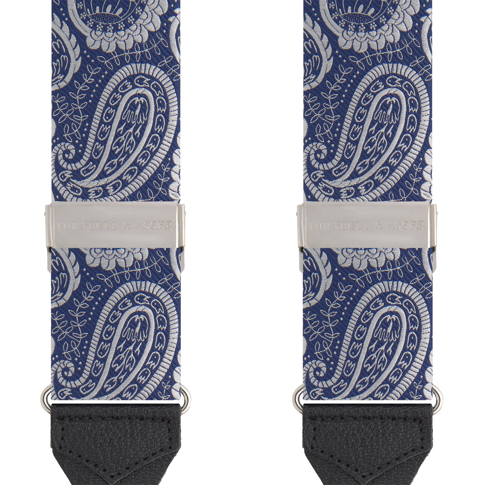 Two Jacquard Silk Paisley Braces by Turnbull & Asser, featuring a blue and white pattern, silver hardware, and black leather ends, are displayed side by side on a plain white background.