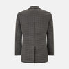 View 3 of product The Fulham Shadow Grey Single-Breasted Quilted Blazer by Turnbull & Asser features a checkered pattern, notched lapel, three front buttons, chest pocket, and two flap pockets—ideal for formal wear on a plain white background.