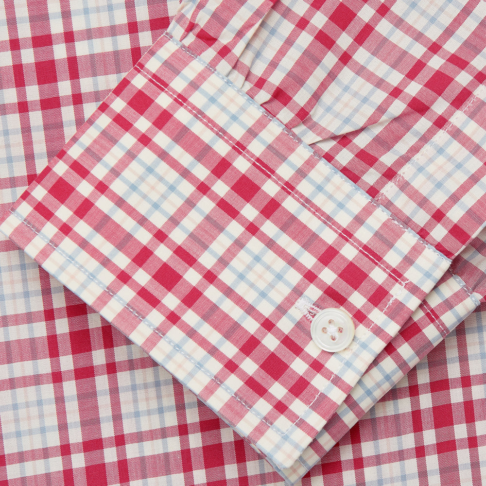 The Turnbull & Asser Red Check Cotton Weekend Fit Finch Shirt is a men's long-sleeved, button-up shirt with a Derby collar and red-and-white plaid pattern, displayed flat on a white background.