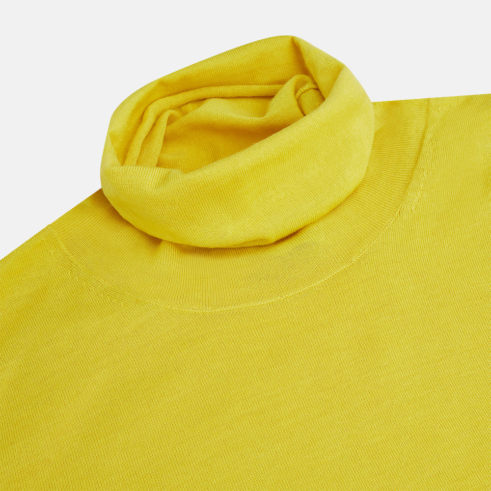 The Turnbull & Asser Canary Yellow Fine Merino High Neck Jumper features soft merino wool, long sleeves, and a classic turtleneck design, presented on a plain white background.