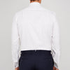 View 3 of product A neatly folded Turnbull & Asser White Oxford Shirt with T&A collar and double cuffs is displayed on a light blue background.