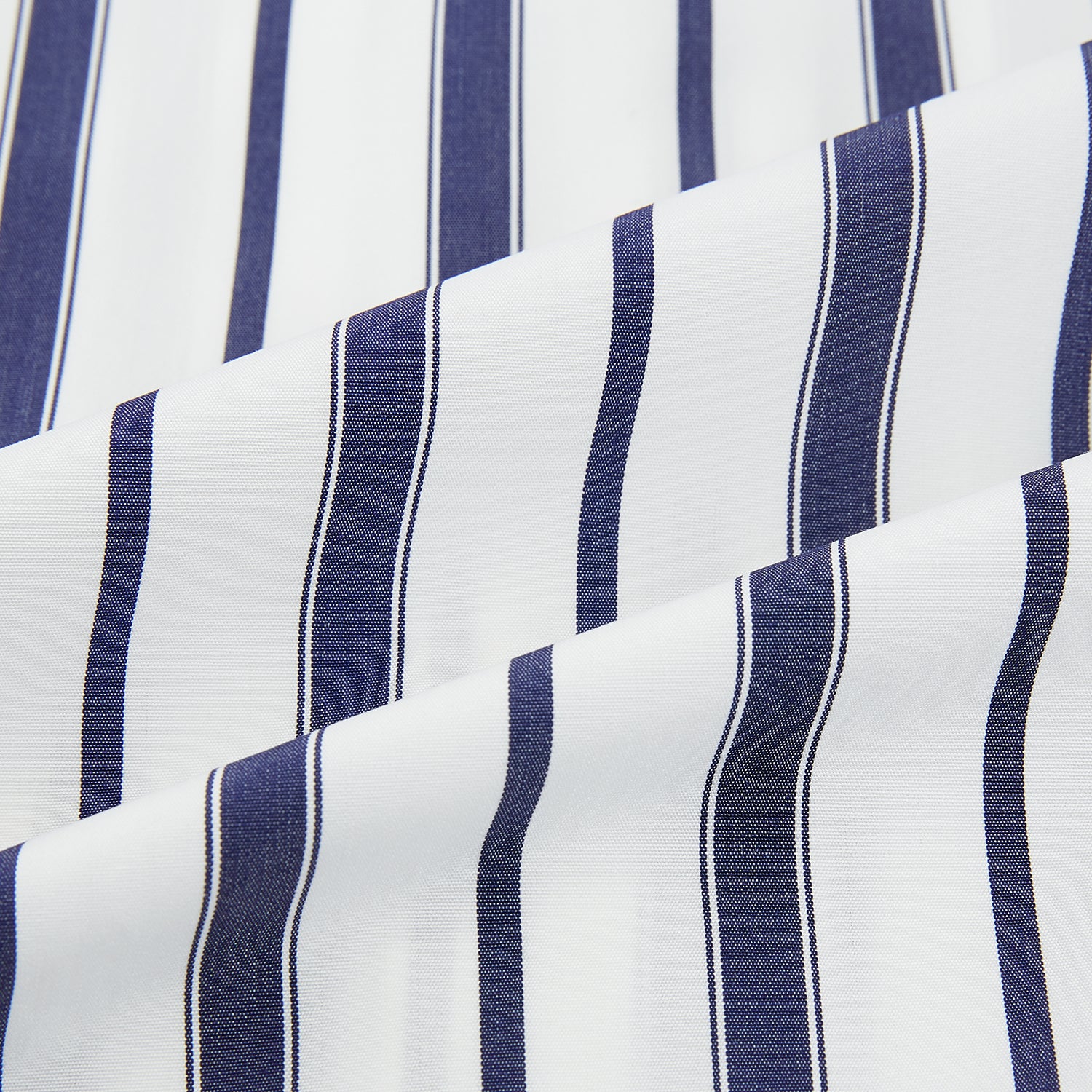 View 6 of product The Navy Double Stripe Mayfair Shirt by Turnbull & Asser features classic long sleeves, buttoned cuffs, a collar, and a slightly curved hem with timeless vertical navy and white stripes.