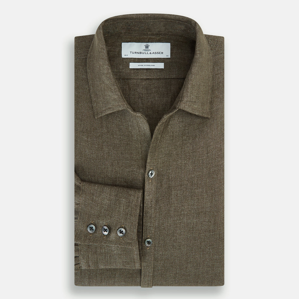 The Olive Linen Windsor Shirt by Turnbull & Asser features long sleeves, a classic Windsor collar, buttoned cuffs, and a straight hem—expertly crafted in Britain and shown against a white background.