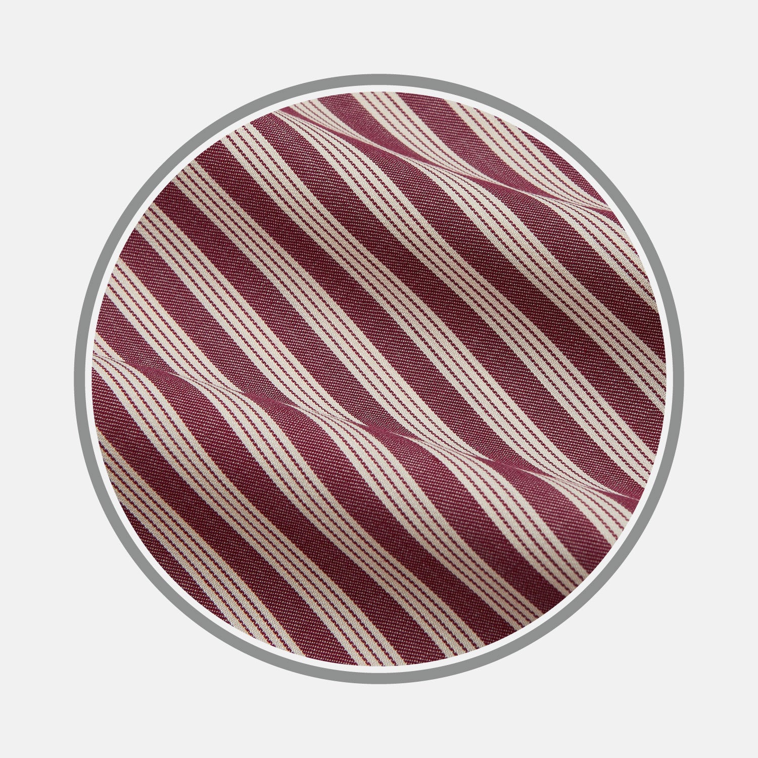 View 1 of product Close-up of Turnbull & Asser's Burgundy Multi Stripe Wool Fabric, featuring diagonal maroon and white stripes, shown within a circular frame on a light gray background.