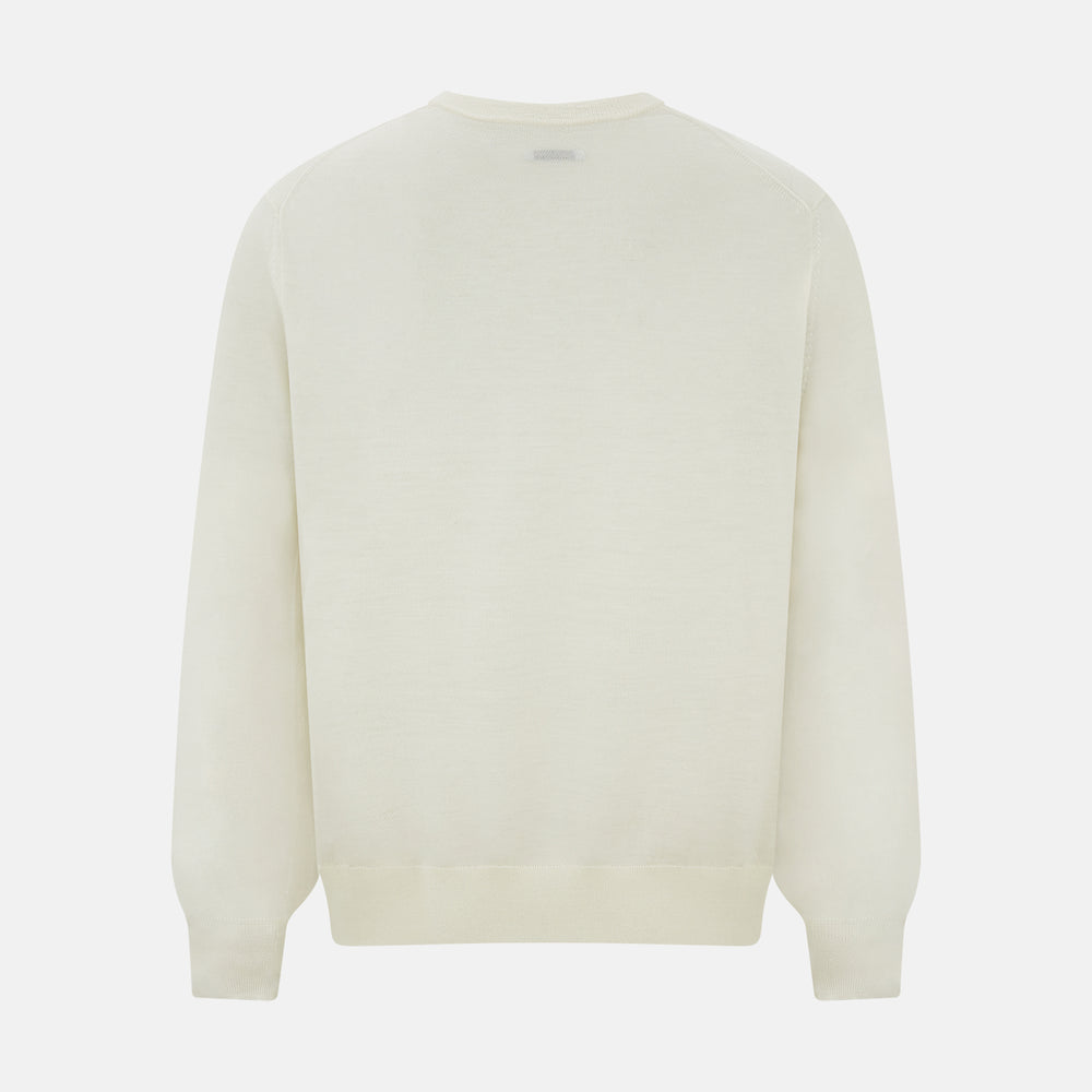 The Turnbull & Asser Cream Fine Merino V-Neck Jumper features long sleeves and classic styling, displayed against a white background.