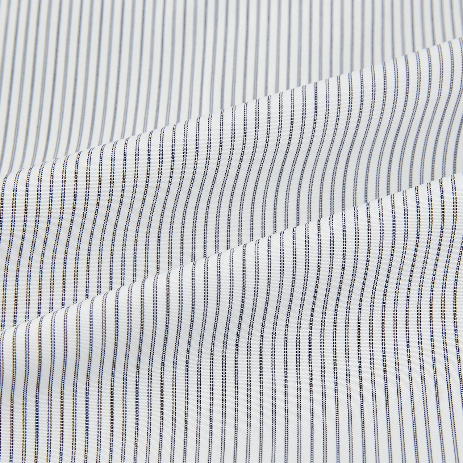 View 6 of product A long-sleeved Midnight Blue Fine Track Stripe Mayfair Shirt by Turnbull & Asser, featuring a T&A collar and white buttons, is laid neatly flat on a white background.