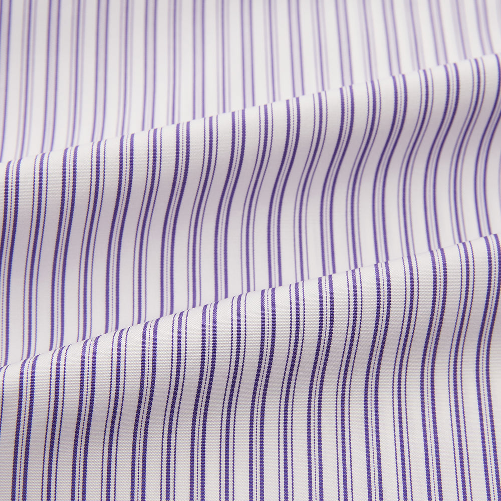 The Turnbull & Asser Purple Ticking Stripe Mayfair Shirt is a long-sleeve button-up with a T&A collar and slim blue-and-white vertical stripes, shown on a white background.