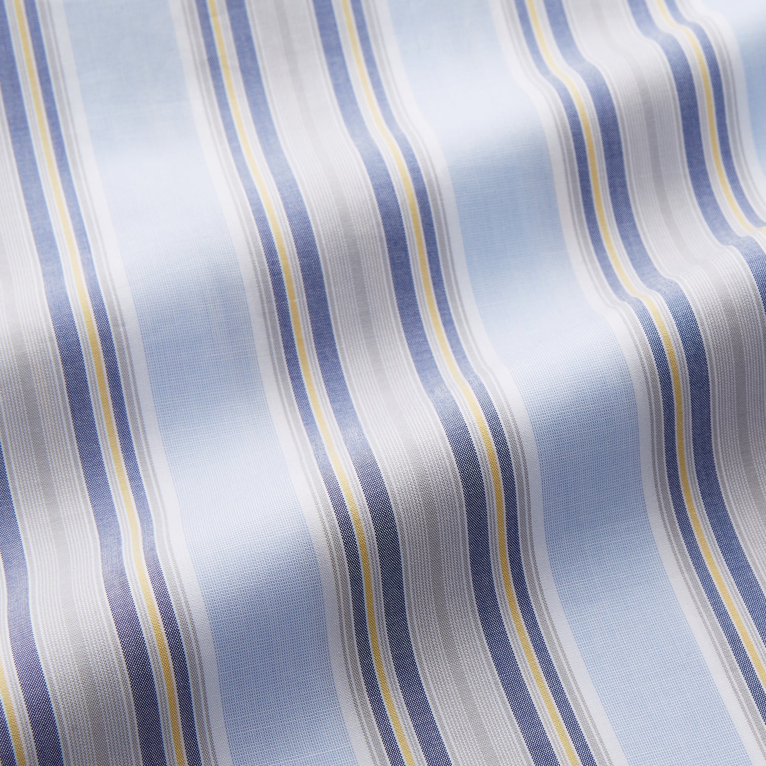 View 2 of product The Pale Blue and Yellow Multi Stripe Cotton Sussex Nightshirt by Turnbull & Asser features long sleeves, a knee-length cut, a collar, button-down front, chest pocket, and rounded hem.