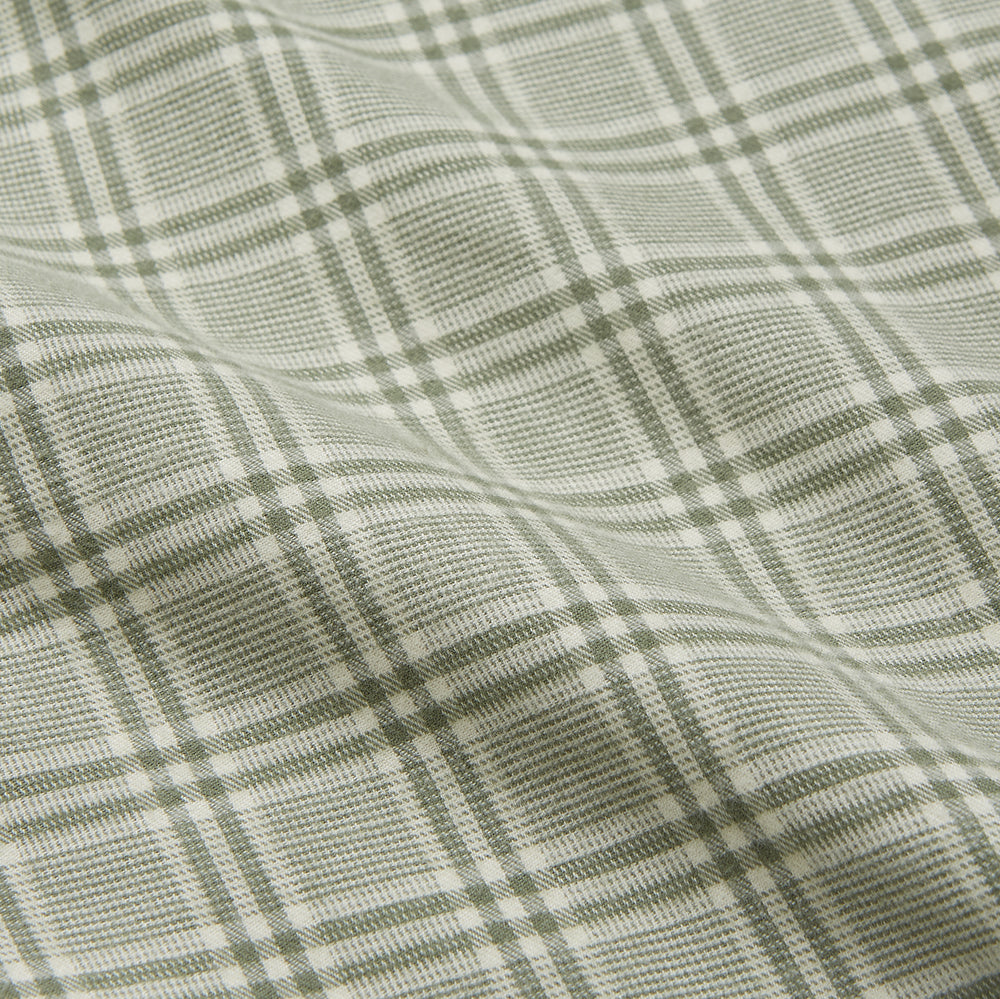 The Turnbull & Asser Green Check Modern Cotton Pyjama Set features a contemporary fit in white and green plaid, made from thicker cotton for added comfort.