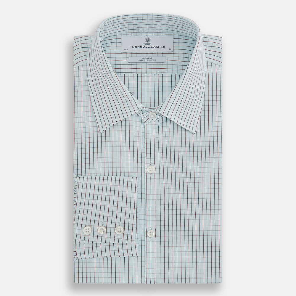 The Turnbull & Asser Forest Melange and Red Overlay Grid Check Westminster Shirt features long sleeves, a pointed collar, and buttoned cuffs, highlighting British craftsmanship. It's shown laid flat against a white background.
