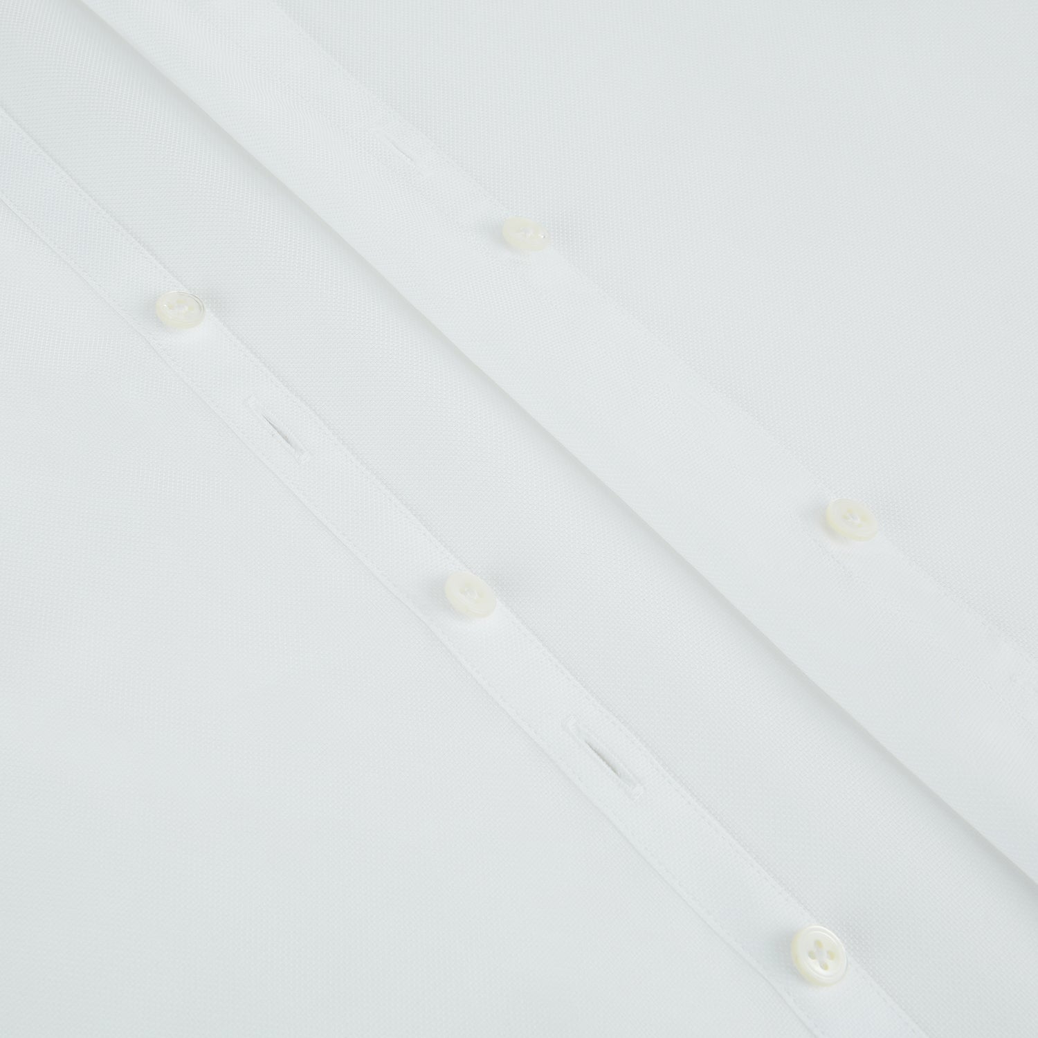 View 7 of product The Turnbull & Asser White Royal Oxford Cotton Windsor Shirt features a Turnbull open collar, long sleeves, 3-button cuffs, and a straight hem, shown against a plain white background.