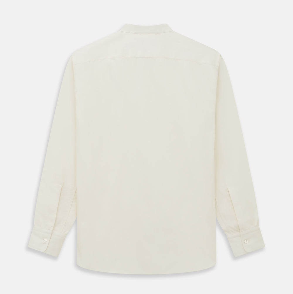 The Turnbull & Asser Cream Cotton Weekend Fit Unwin Shirt features long sleeves, a stand collar, and two chest pockets, shown laid flat on a white background.