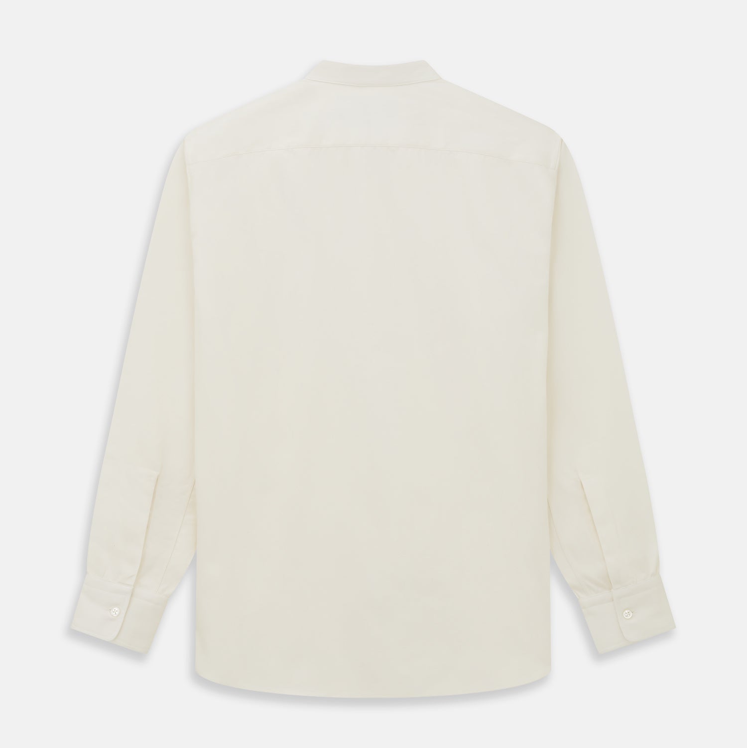 View 5 of product The Turnbull & Asser Cream Cotton Weekend Fit Unwin Shirt features long sleeves, a stand collar, and two chest pockets, shown laid flat on a white background.