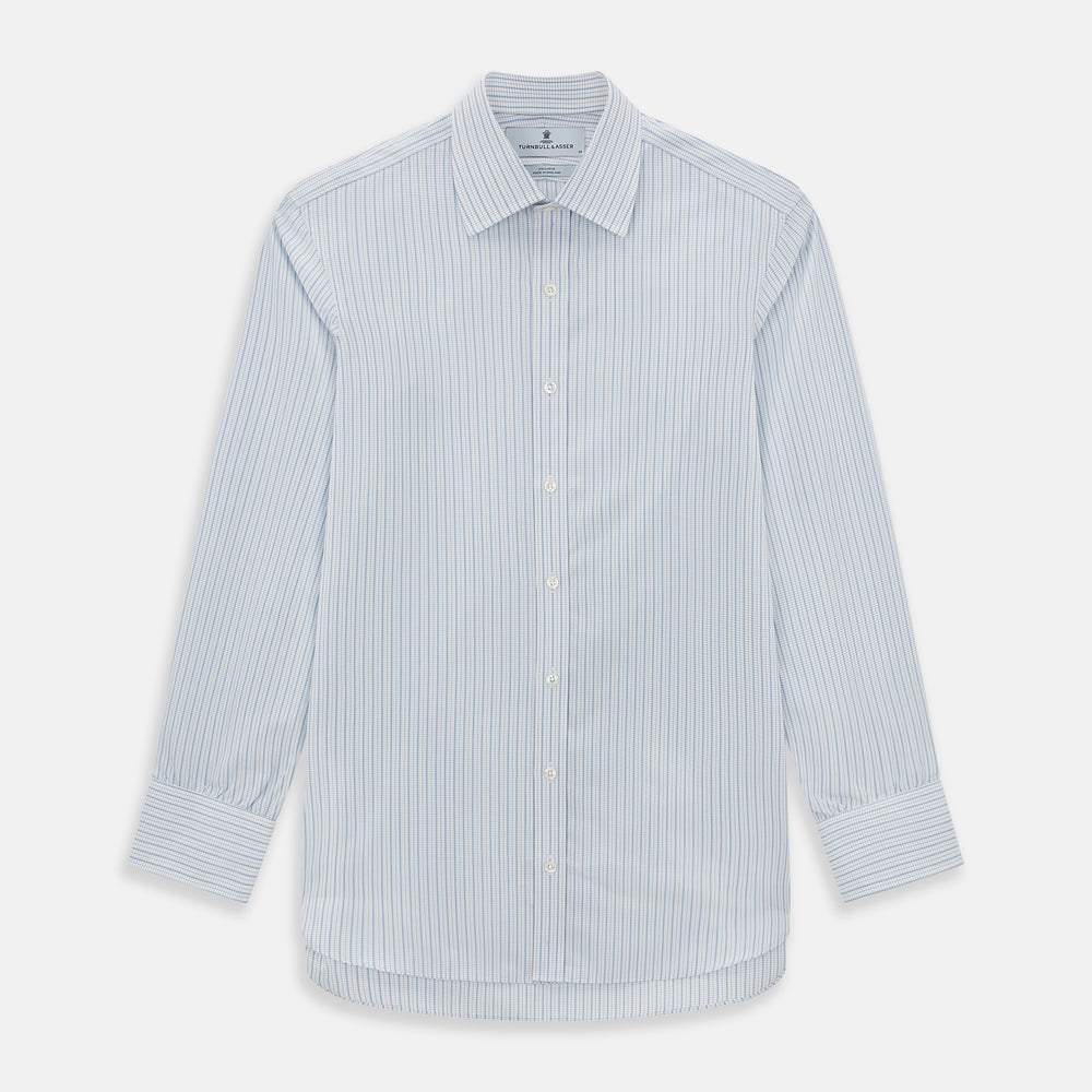 The Turnbull & Asser Blue Graph Check Mayfair Shirt features a classic T&A collar, Mayfair fit, buttoned cuffs, and long sleeves with light blue graph checks on a white background.