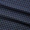 View 3 of product The Turnbull & Asser Navy Check Cotton Weekend Fit Blake Shirt features a long-sleeve, button-up design with a stand collar and white buttons, shown on a white background.