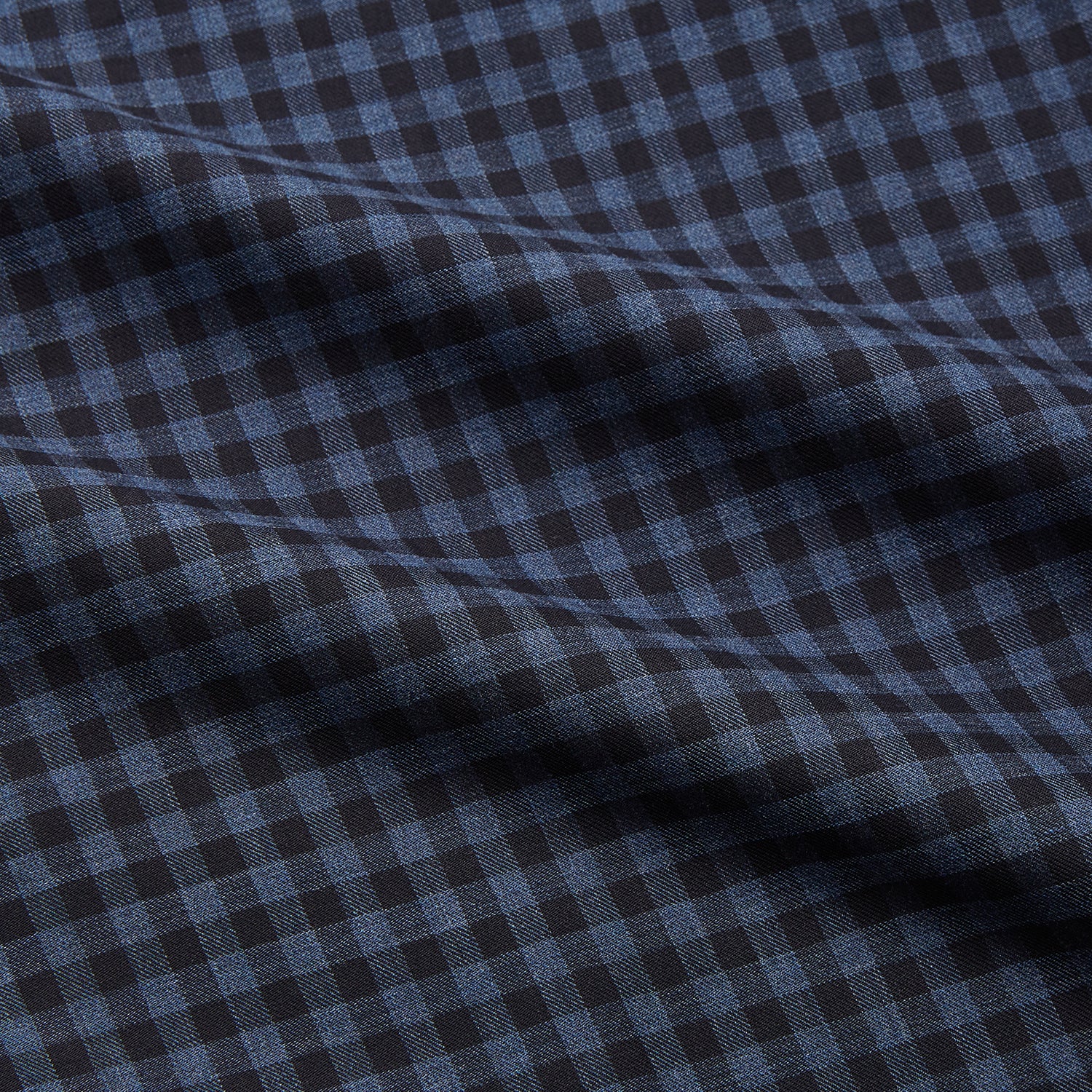 View 3 of product The Turnbull & Asser Navy Check Cotton Weekend Fit Blake Shirt features a long-sleeve, button-up design with a stand collar and white buttons, shown on a white background.