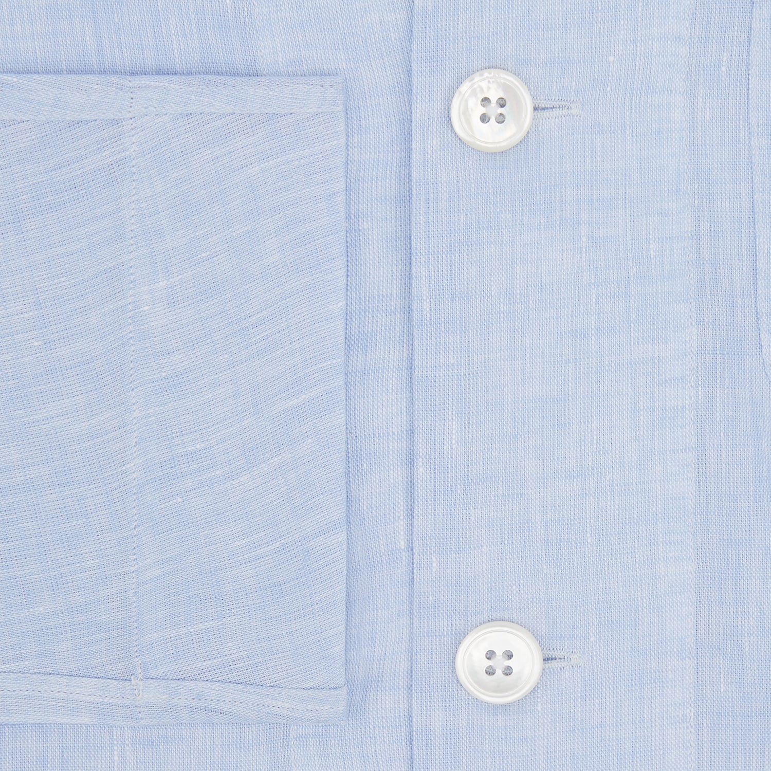 View 4 of product The Turnbull & Asser Pale Blue Linen Pyjama Shirt features long sleeves, a collar, front buttons, and a chest pocket—perfect as elegant loungewear or nightwear.