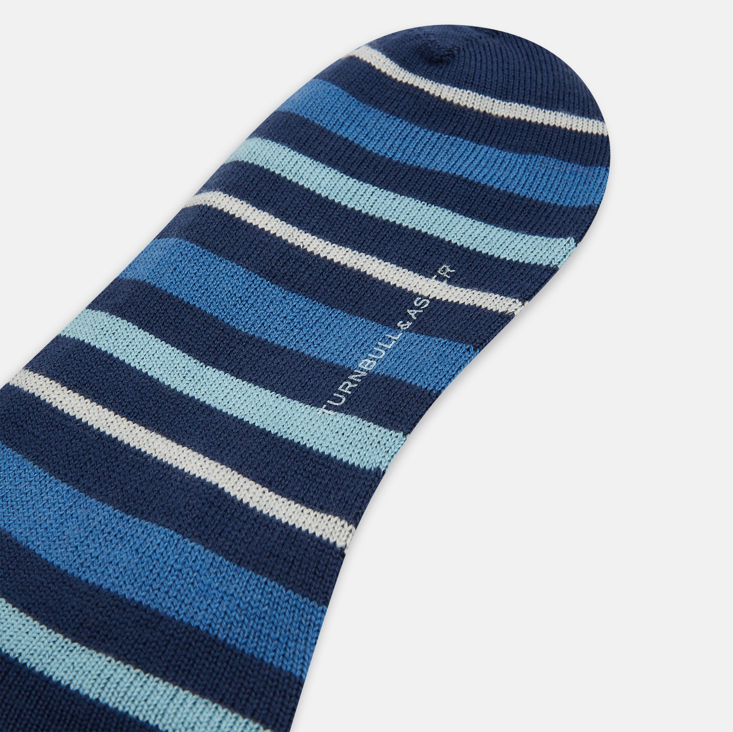 View 3 of product Turnbull & Asser's Azzurro Striped Merino Wool Long Socks feature horizontal stripes in blue, navy, and gray—ideal over-the-calf socks for everyday style.