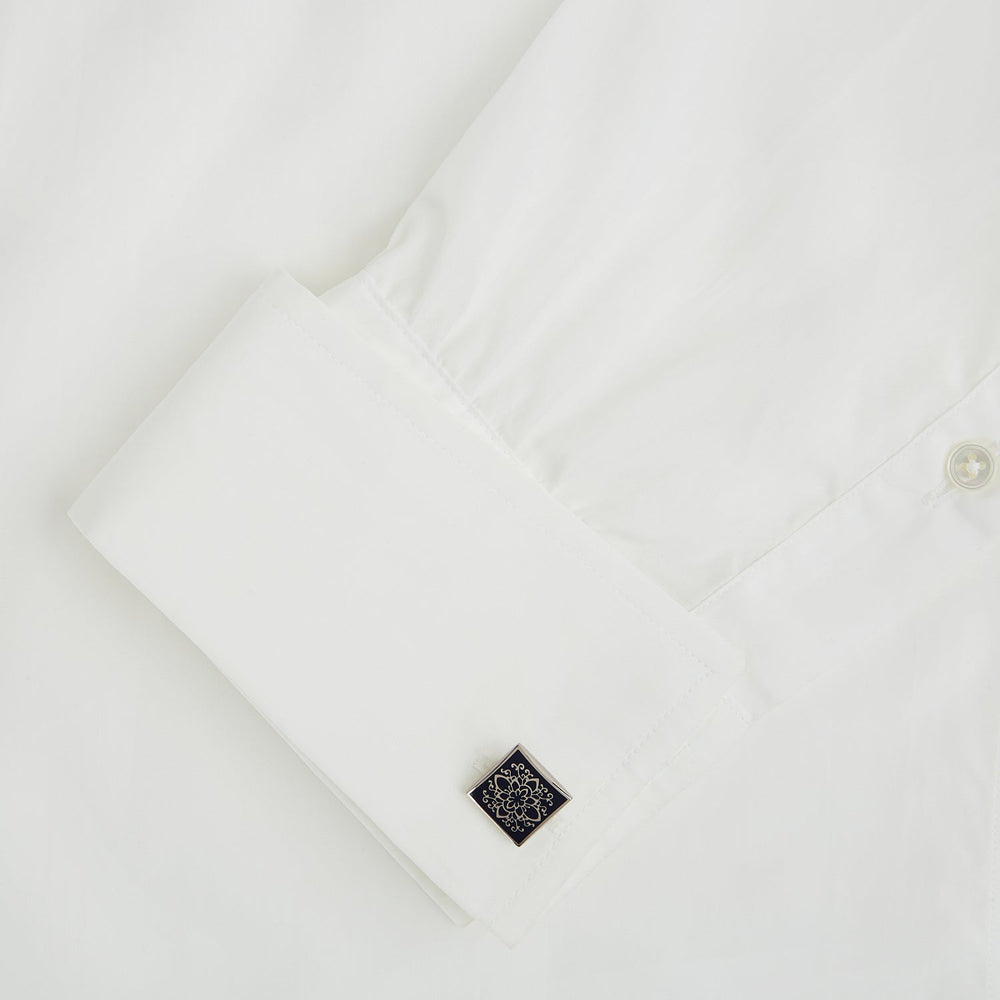 Turnbull & Asser Blue Floral Square Cufflinks feature a navy center with an intricate white floral pattern, accented by a sterling silver border.