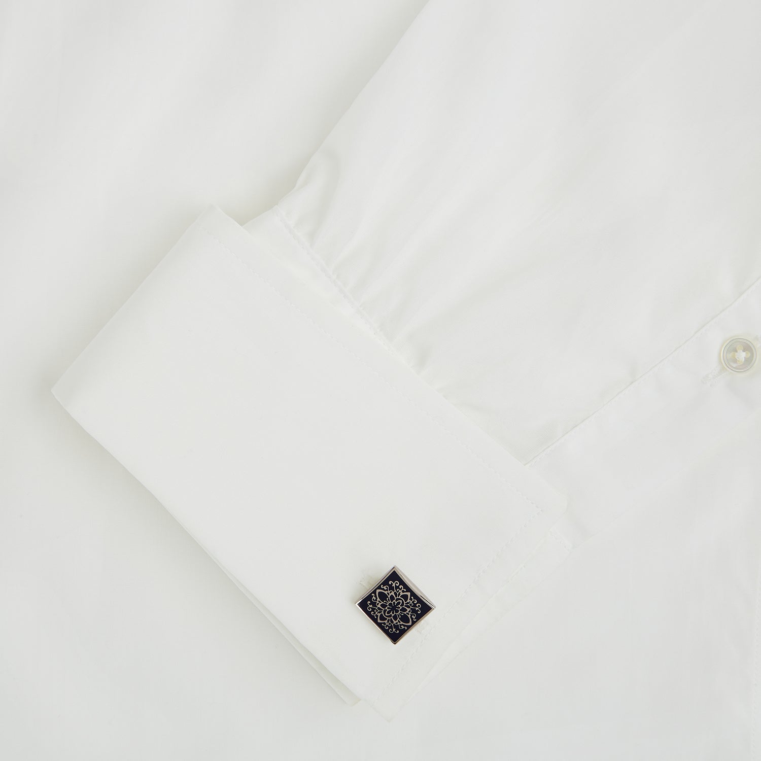 View 3 of product Turnbull & Asser Blue Floral Square Cufflinks feature a navy center with an intricate white floral pattern, accented by a sterling silver border.