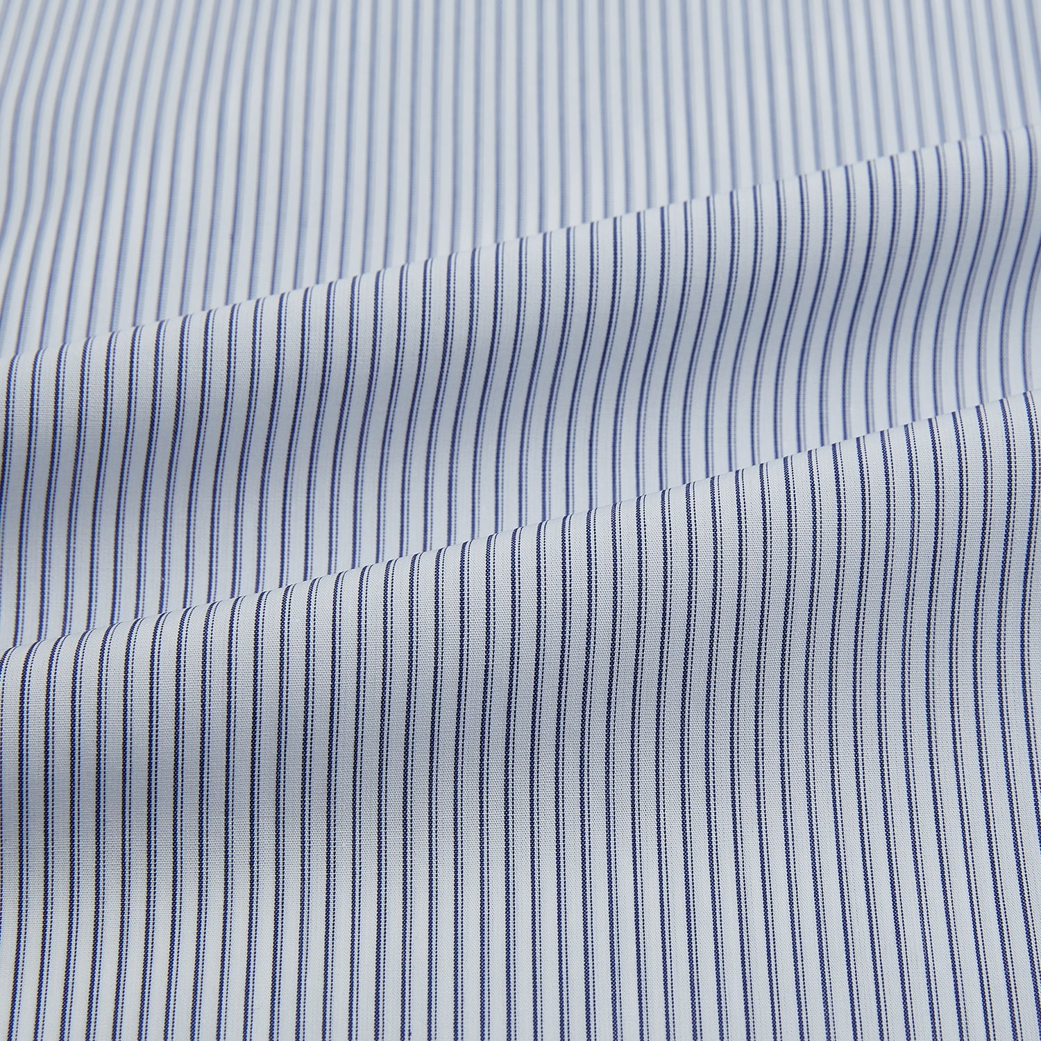 View 6 of product The Navy and White Ticking Stripe Mayfair Shirt by Turnbull & Asser features long sleeves, buttoned cuffs, a pointed T&A collar, and button-up front, shown on a plain white background.