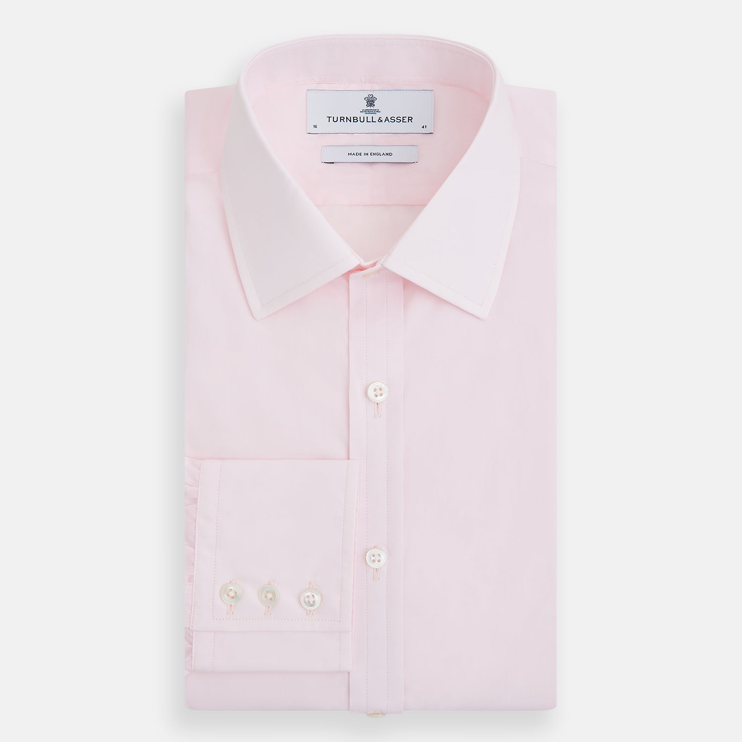 View 5 of product The Turnbull & Asser Pink Mayfair Shirt features long sleeves, a classic collar, and white buttons—a refined choice for any men's wardrobe. Laid flat against a white background, it highlights timeless style and craftsmanship.