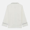 View 8 of product The Women's Harriet Cream Silk Pyjama Set by Turnbull & Asser features a white sand-washed silk button-up top with black piping and chest pocket, plus matching drawstring pants, all shown against a white background.