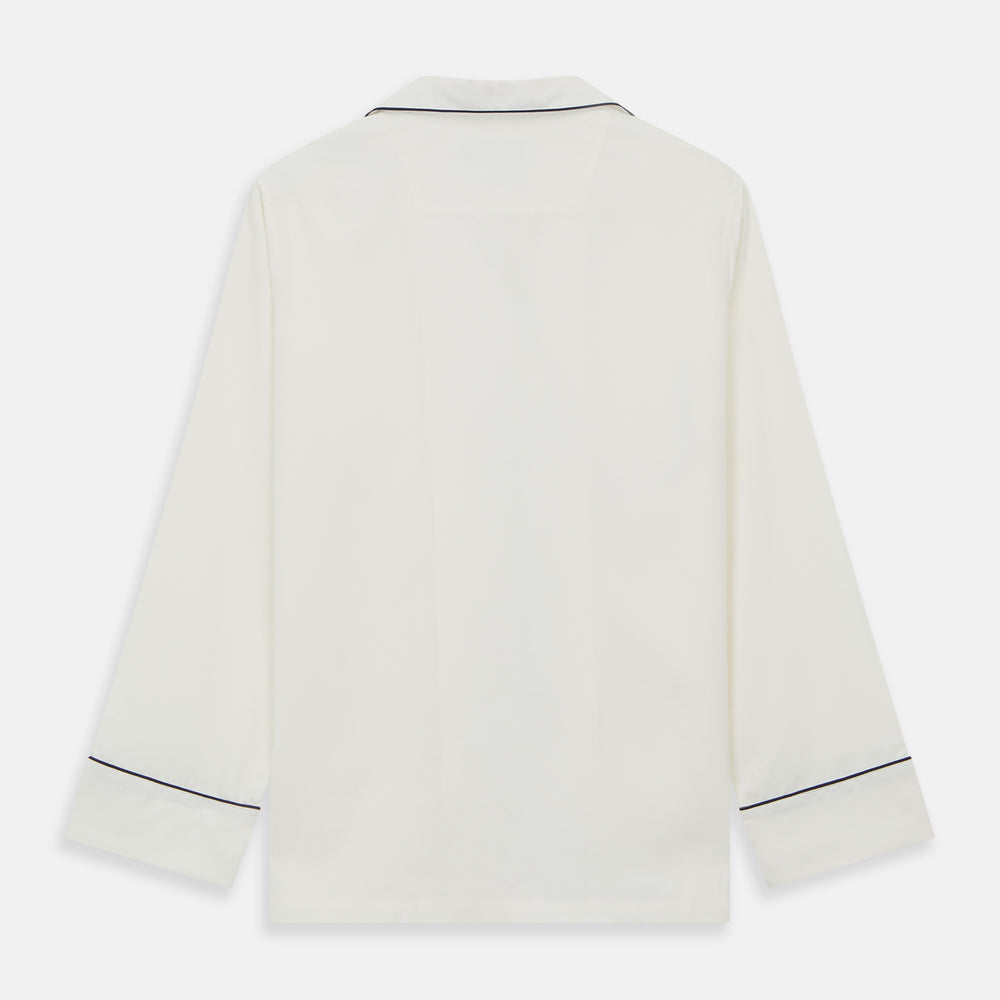 The Women's Harriet Cream Silk Pyjama Set by Turnbull & Asser features a white sand-washed silk button-up top with black piping and chest pocket, plus matching drawstring pants, all shown against a white background.