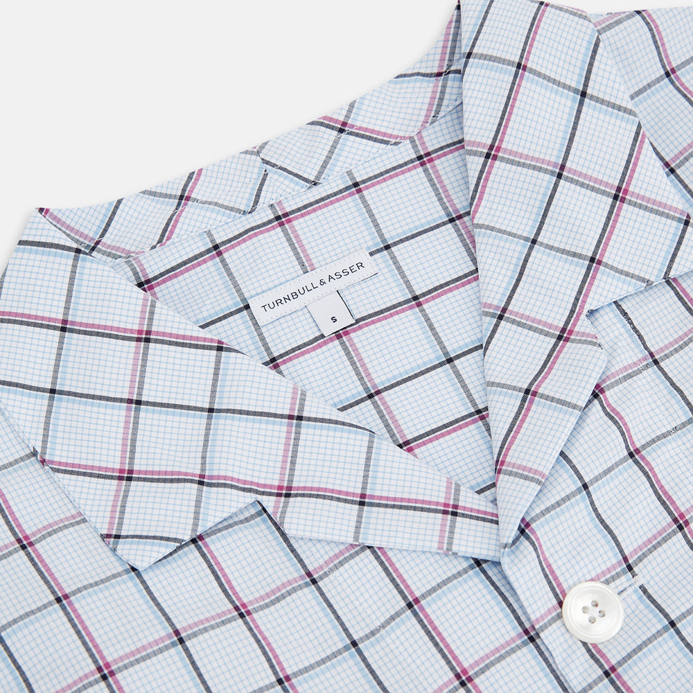 The Turnbull & Asser Burgundy and Blue Check Pyjama Shirt features a classic collar, button-up front, and grid check pattern—an elegant choice for nightwear or comfortable sleepwear.
