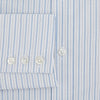 View 4 of product The Turnbull & Asser Blue Graph Check Mayfair Shirt features a classic T&A collar, Mayfair fit, buttoned cuffs, and long sleeves with light blue graph checks on a white background.