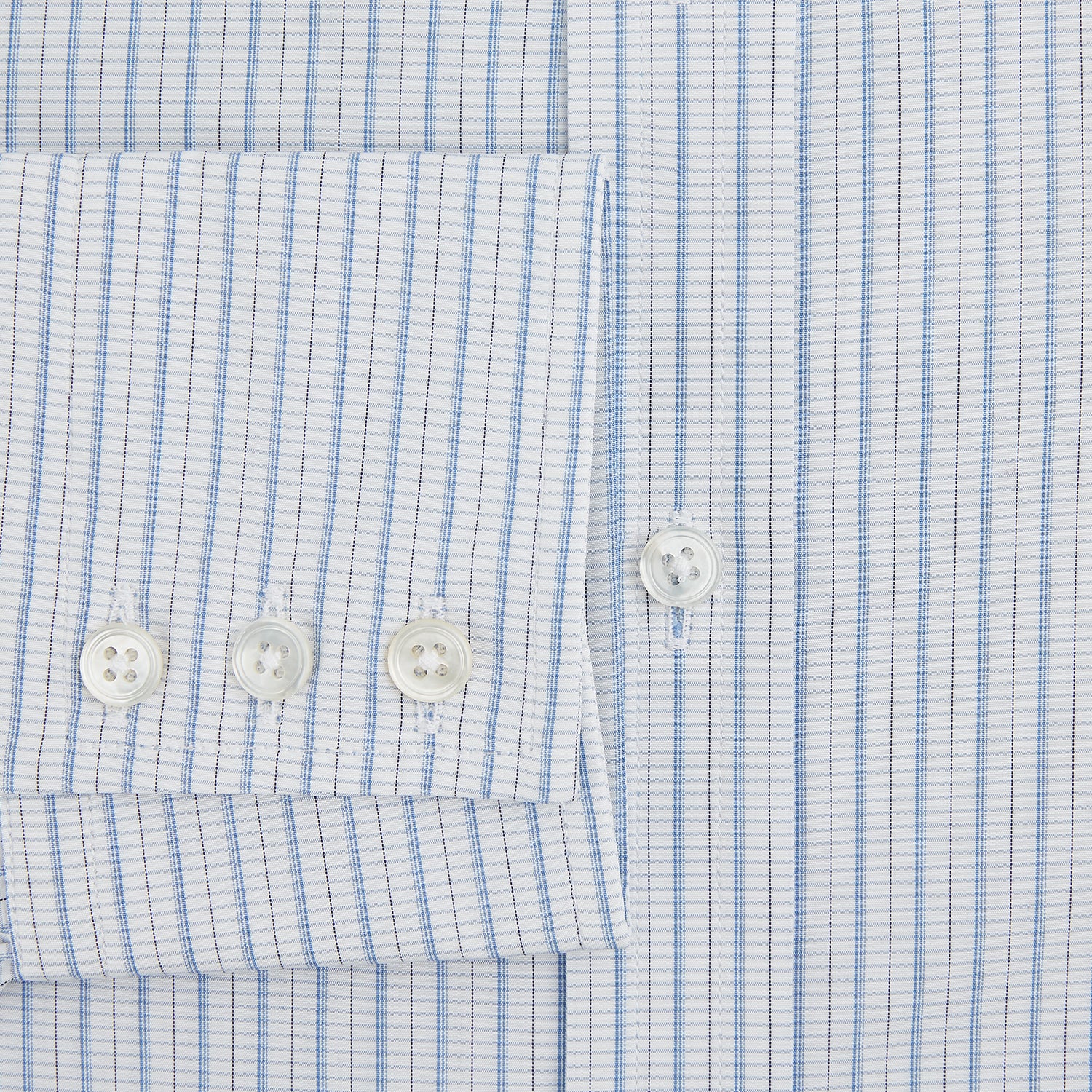 View 4 of product The Turnbull & Asser Blue Graph Check Mayfair Shirt features a classic T&A collar, Mayfair fit, buttoned cuffs, and long sleeves with light blue graph checks on a white background.