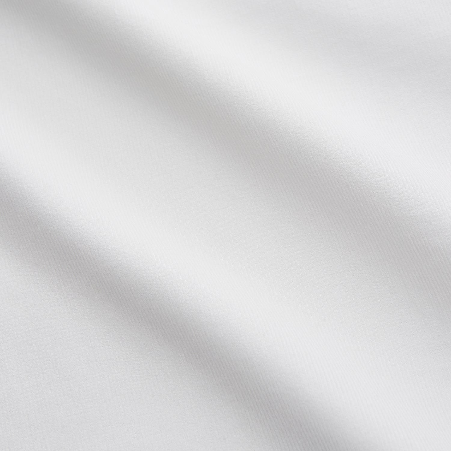 View 4 of product The White Cotton Weekend Fit Langston Shirt by Turnbull & Asser, with a Derby collar, long sleeves, and two button-flap chest pockets, is shown laid flat on a white background.