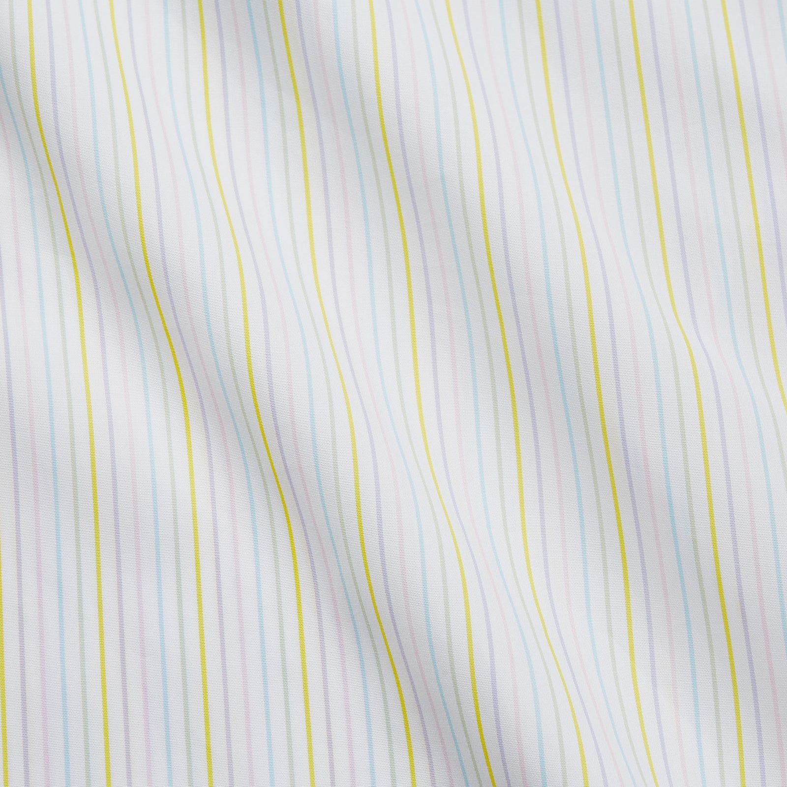 View 4 of product The Turnbull & Asser Yellow Multi Stripe Cotton Regular Fit Whitby Shirt features long sleeves, a classic collar, and thin yellow and blue stripes on white, displayed on a plain white surface.