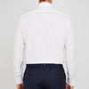 View 3 of product A neatly folded Turnbull & Asser Two-Fold 200 White Cotton Shirt with a Regent collar and 3-button cuffs, crafted from breathable fabric, is displayed on a light grey background with the label visible inside the collar.