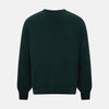 View 3 of product The Turnbull & Asser Petrol Green Merino V-Neck Jumper features long sleeves and ribbed cuffs and hem—an essential knitwear piece, shown against a white background.