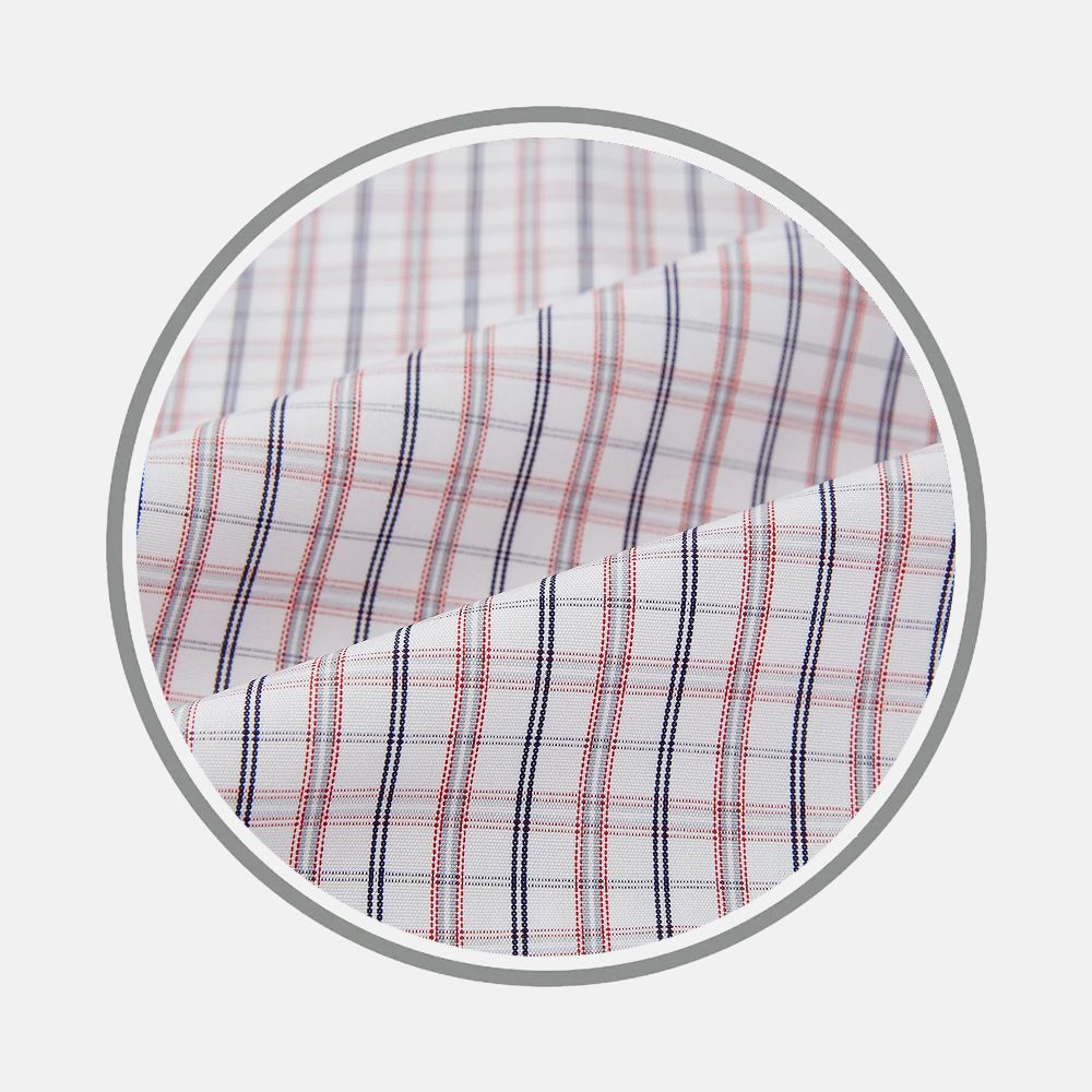 Close-up of Turnbull & Asser's Red And Blue Multi Check Fabric, showing a plaid pattern with red and navy blue lines on white, displayed in a circular frame.