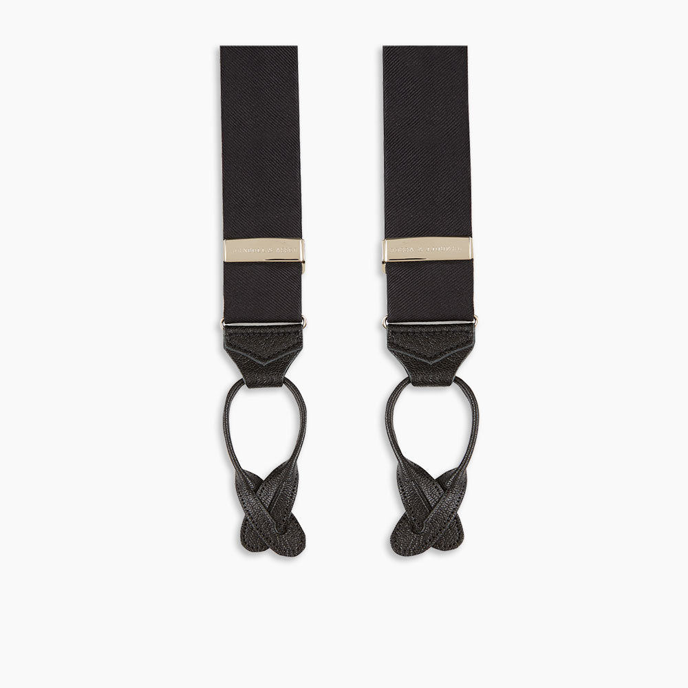Turnbull & Asser Black Herringbone Adjustable Silk Braces feature leather button loops and silver adjusters—ideal for refined sartorial style. Displayed on a white background.