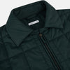 View 2 of product The Turnbull & Asser Battersea Forest Green Quilted Jacket for men features a front zipper, collared neckline, angled chest pocket, two zippered side pockets, and adjustable snap cuffs—shown on a plain white background.
