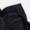 View 2 of product The Turnbull & Asser Navy and Grey Dot Silk Pocket Square features a neatly folded design with small grey dots on navy silk and a solid border, showcasing both sides of the luxurious fabric.