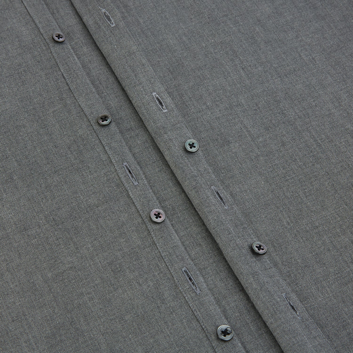 View 7 of product The Pale Charcoal Westminster Shirt by Turnbull & Asser features British craftsmanship with a tailored silhouette, long sleeves, pointed collar, buttoned cuffs, and a solid pale charcoal hue, elegantly shown against a white background.