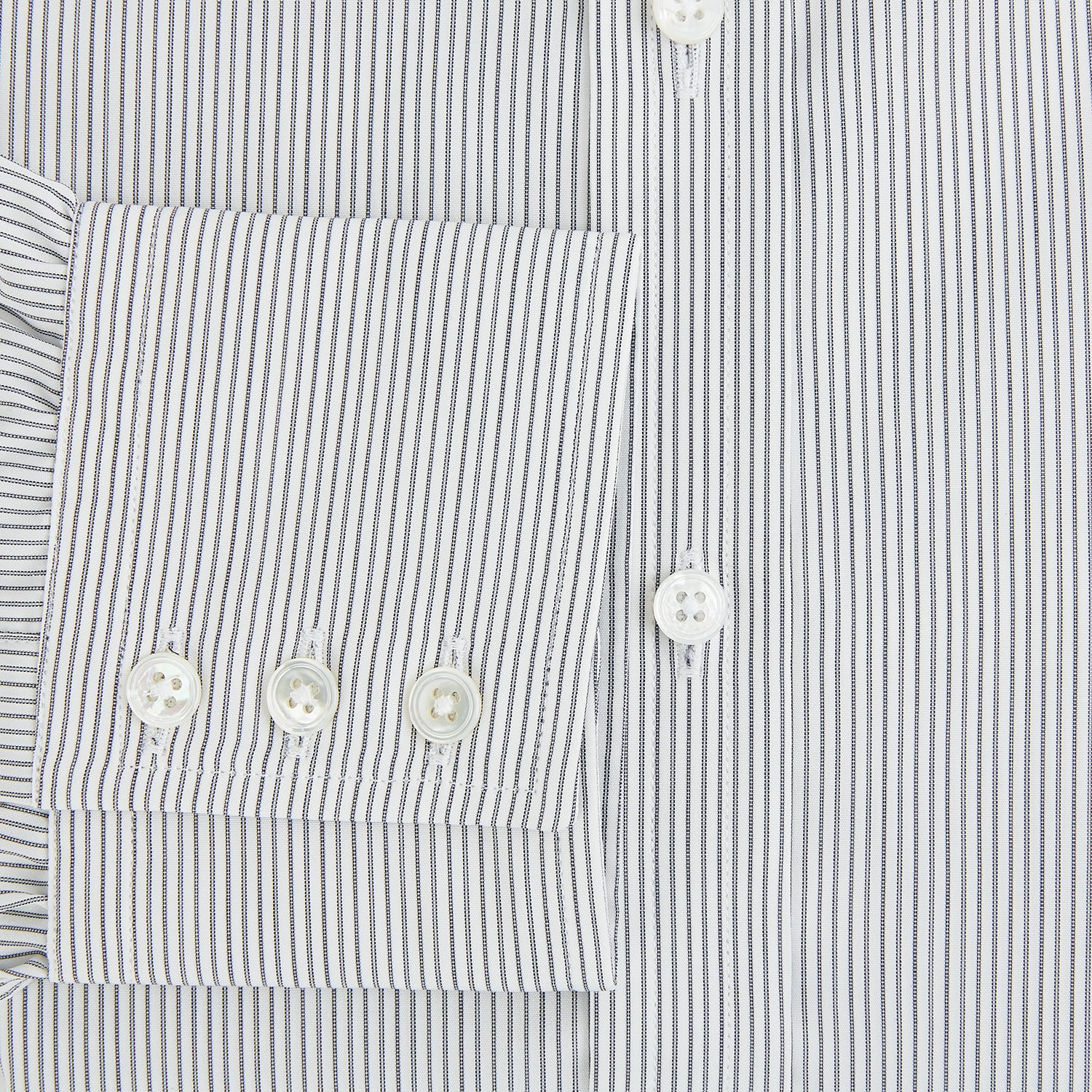 View 4 of product A long-sleeved Midnight Blue Fine Track Stripe Mayfair Shirt by Turnbull & Asser, featuring a T&A collar and white buttons, is laid neatly flat on a white background.