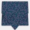View 1 of product Turnbull & Asser's Multicoloured Dark Navy Circle Silk Cravat features blue, white, and green-outlined circles—ideal for weddings or pairing with classic British attire.