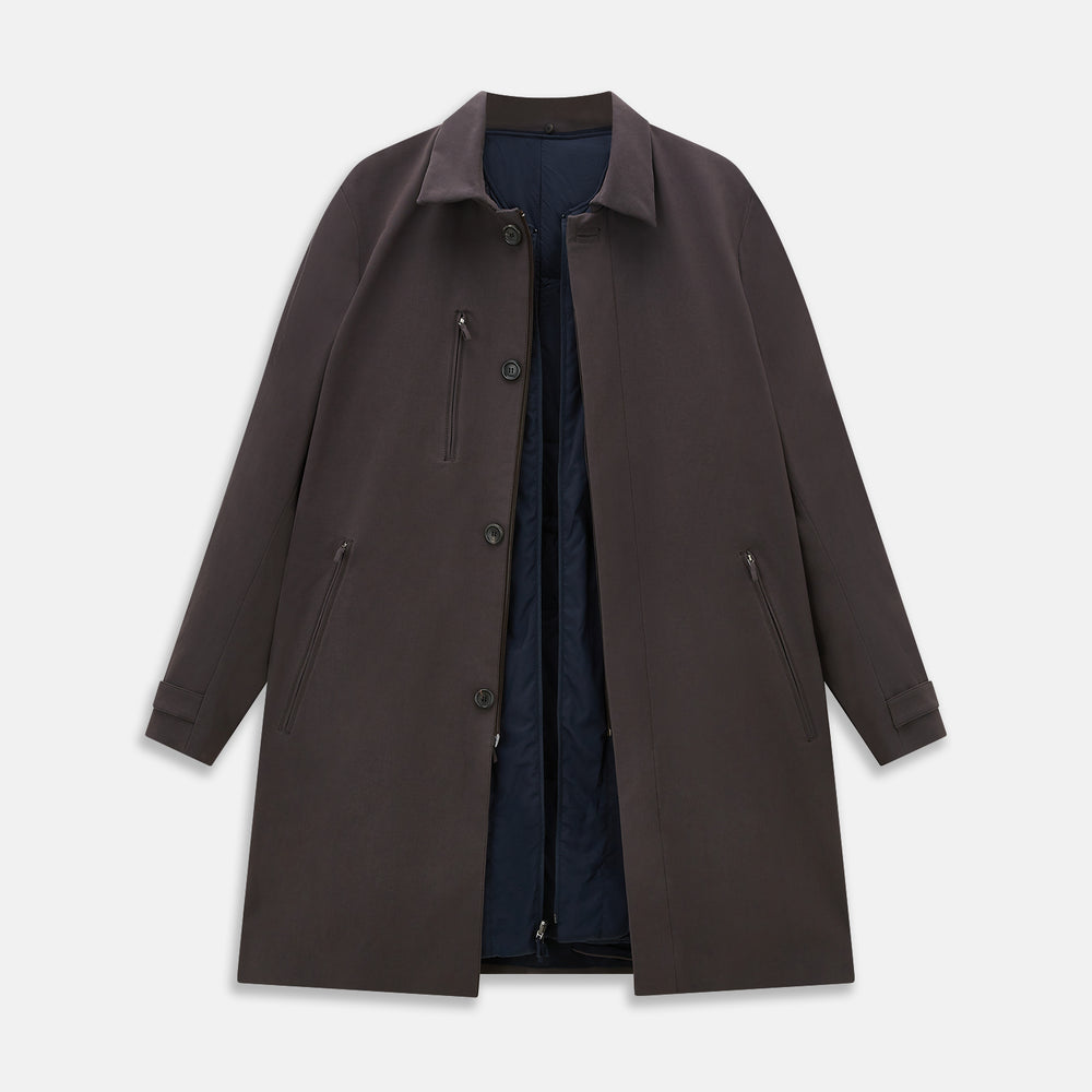 The Dark Chocolate John Arthur Trench Coat by Turnbull & Asser features a pointed collar, two large slanted side pockets, and a vertical chest pocket—a versatile 2-in-1 piece ideal for any occasion.