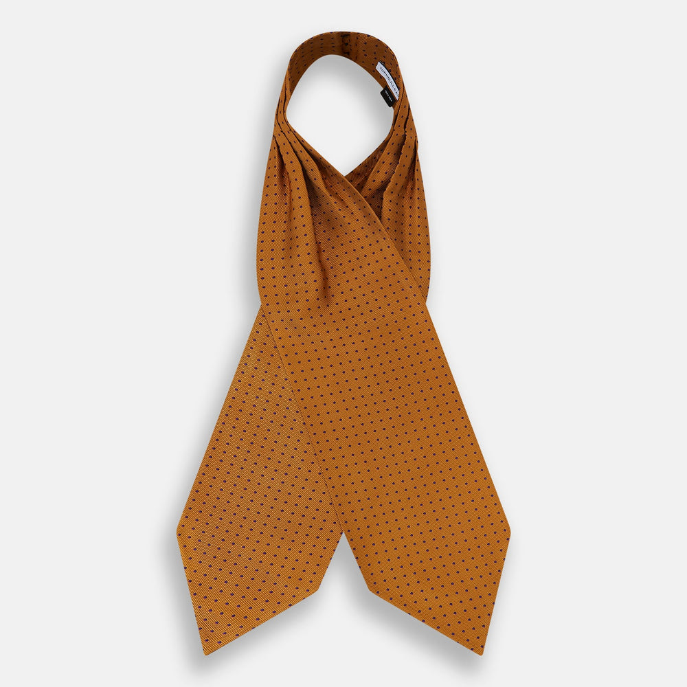 The Navy and Orange Micro Dot Silk Cravat by Turnbull & Asser features a refined pattern of micro dots, bringing color and sophistication to formalwear, displayed against a white background.