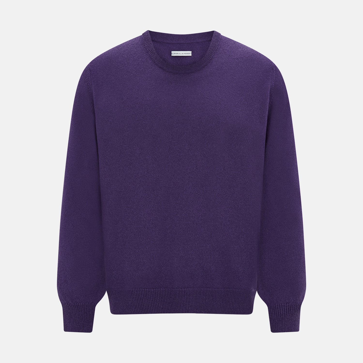 View 1 of product The Turnbull & Asser Purple Cashmere Round Neck Jumper features long sleeves, ribbed cuffs, hem, and collar for an elegant silhouette. This versatile knitwear piece is shown against a white background.