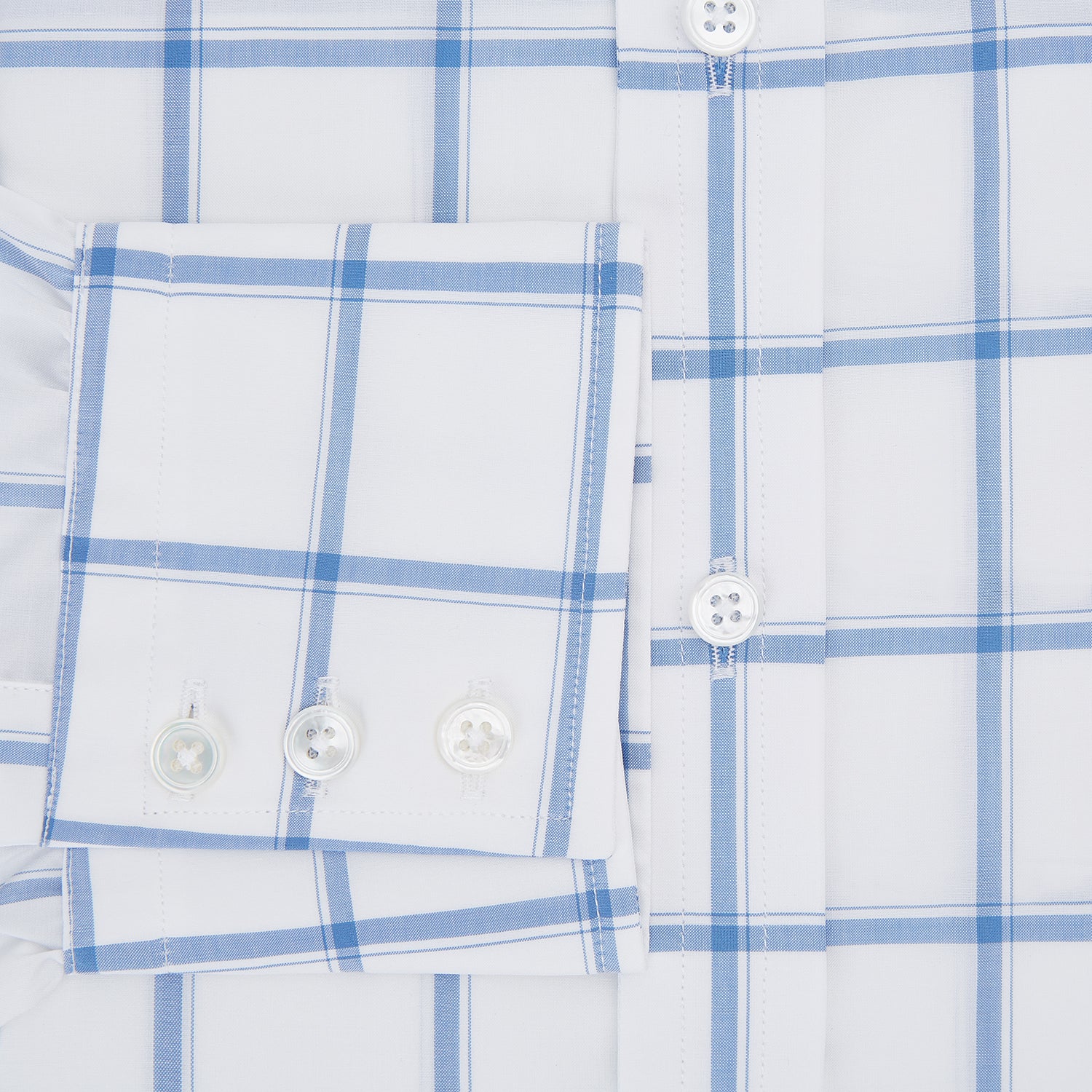 View 4 of product The Turnbull & Asser Colony Blue Grid Check Mayfair Shirt features long sleeves, a button-down front, Italian cotton fabric, a spread collar, and buttoned cuffs, shown against a plain white background.