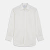 View 1 of product The Turnbull & Asser Yellow Multi Stripe Cotton Regular Fit Whitby Shirt features long sleeves, a classic collar, and thin yellow and blue stripes on white, displayed on a plain white surface.