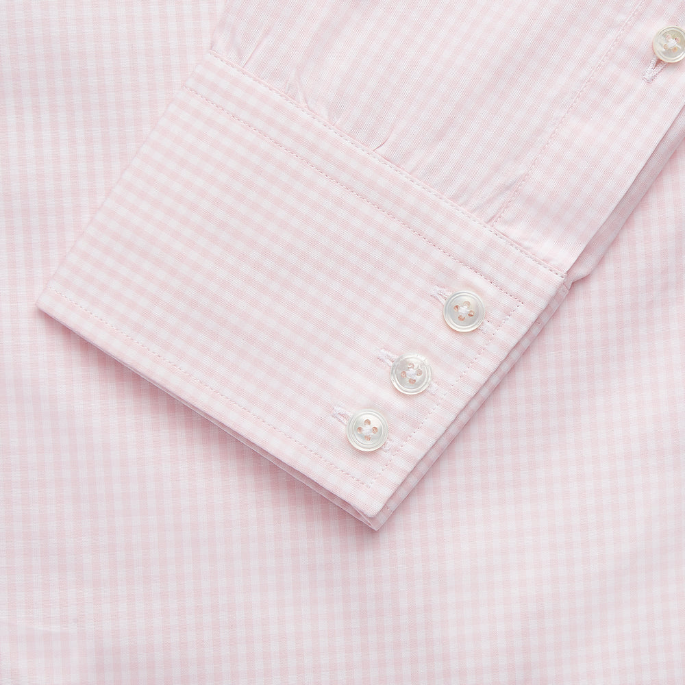 The Turnbull & Asser Pink Windowpane Check Shirt features long sleeves, a button-down front, pointed collar, and buttoned cuffs—an elegant addition to any formal shirt collection.